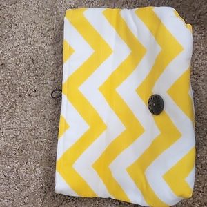 Fold over white and yellow clutch